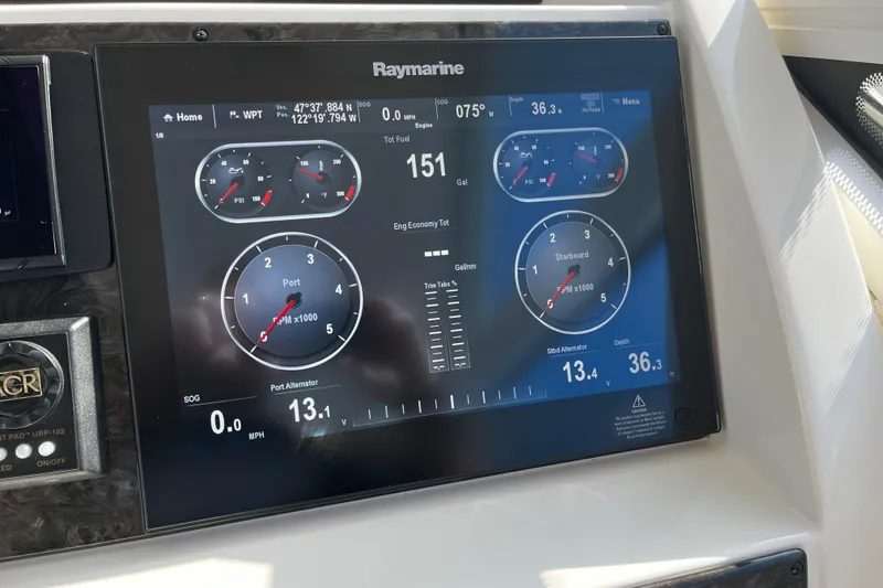 Slide: The Image of Raymarine display on 2010 Sea Ray 450 Sundancer showing engine and navigation data. - 12