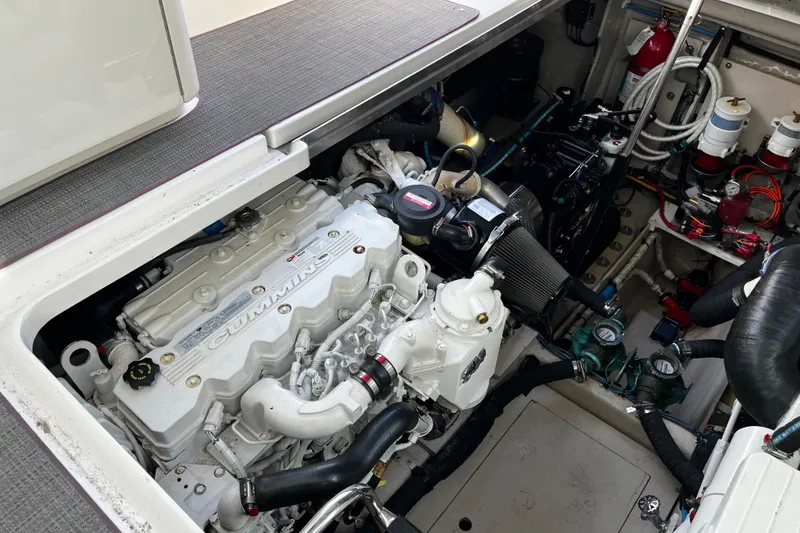 Slide: The Image of Engine compartment of 2010 Sea Ray 450 Sundancer with Cummins engine, showcasing detailed components. - 16