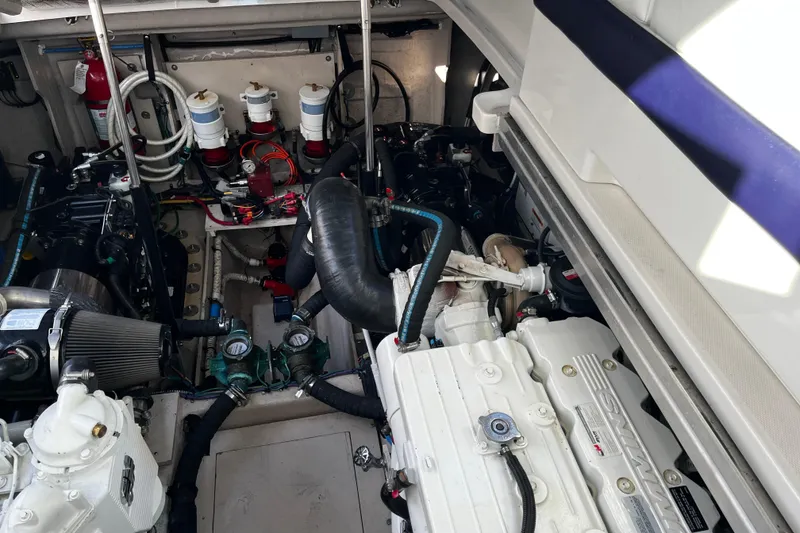 Slide: The Image of Engine room of a 2010 Sea Ray 450 Sundancer, showcasing mechanical components and systems. - 17