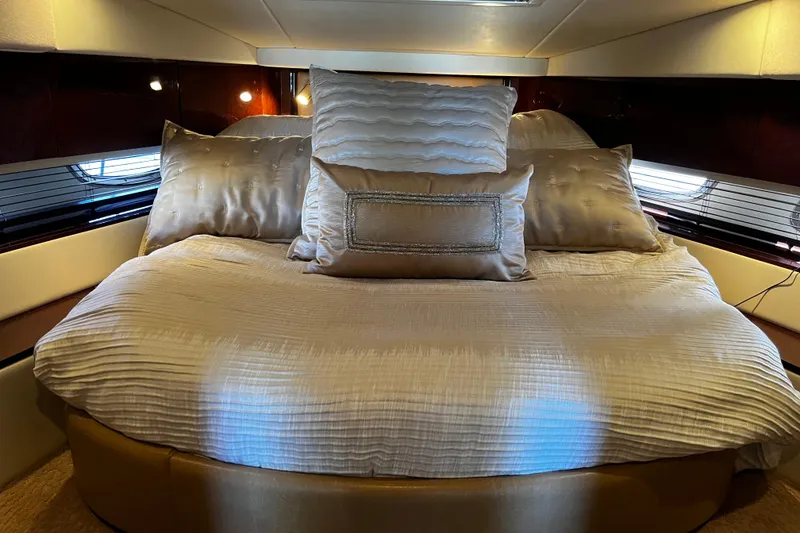 Slide: The Image of Luxurious cabin interior of 2010 Sea Ray 450 Sundancer yacht with plush bedding. - 20