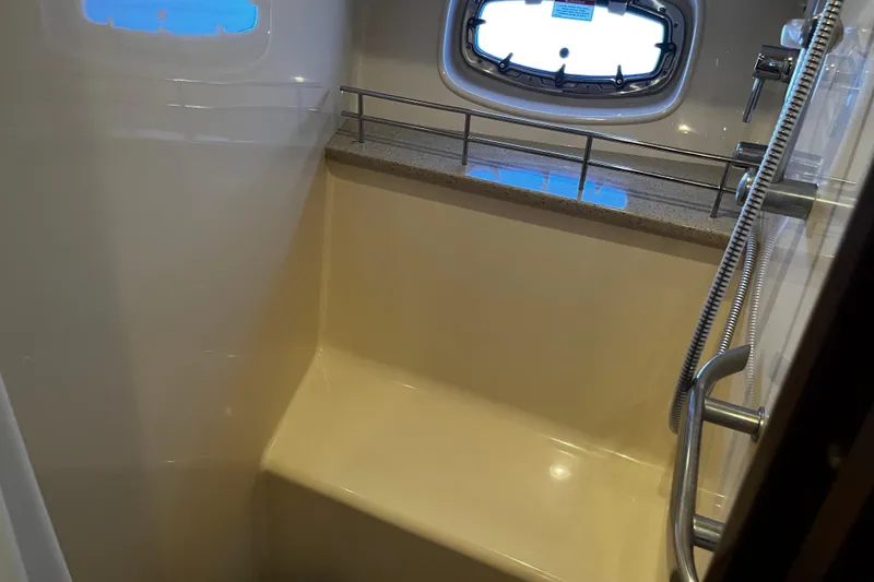 Slide: The Image of Shower area in 2010 Sea Ray 450 Sundancer yacht with window and railings. - 21