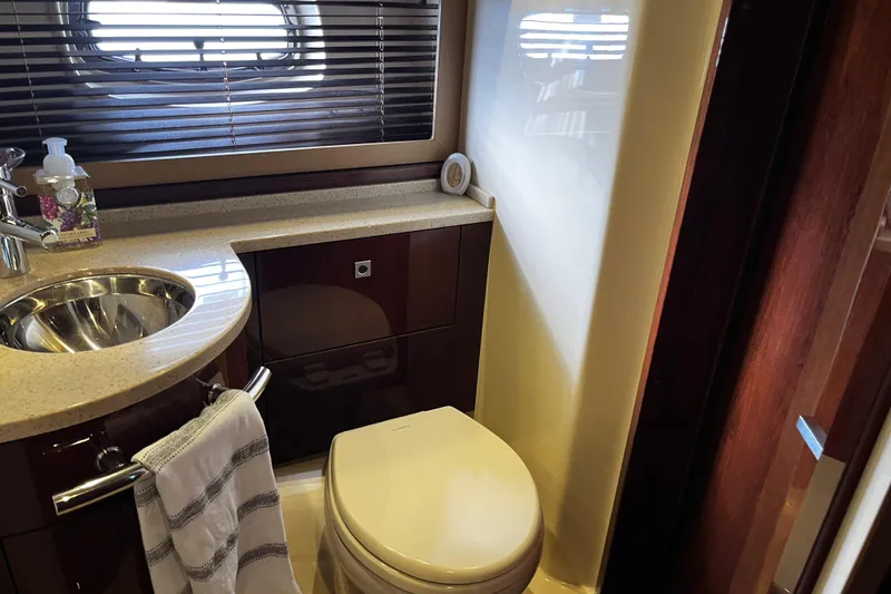 Slide: The Image of Luxurious bathroom in 2010 Sea Ray 450 Sundancer yacht with sink and toilet. - 22
