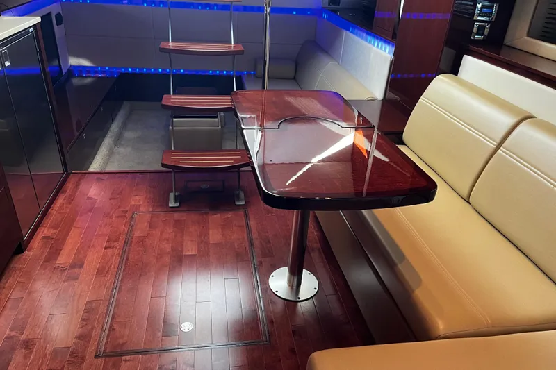 Slide: The Image of Luxurious interior of 2010 Sea Ray 450 Sundancer yacht with elegant wood flooring. - 24