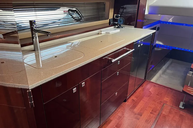 Slide: The Image of Luxurious interior of 2010 Sea Ray 450 Sundancer yacht with sleek kitchen design. - 25