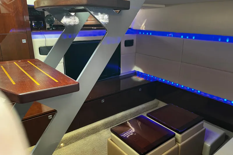 Slide: The Image of Interior of 2010 Sea Ray 450 Sundancer yacht with modern design and blue LED lighting. - 26