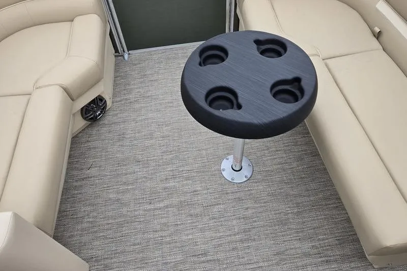 Slide: The Image of 2026 Godfrey Xperience 2286 SBX interior with beige seating and cup holder table. - 7