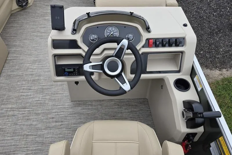 Slide: The Image of 2026 Godfrey Xperience 2286 SBX boat dashboard with steering wheel and controls. - 8