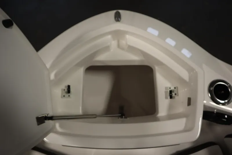 Slide: The Image of Open storage compartment on 2026 Yamaha Boats 222 FSH Sport E. - 12