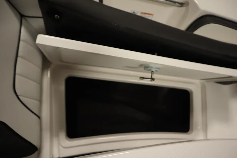 Slide: The Image of Open storage compartment on 2026 Yamaha Boats 222 FSH Sport E. - 14