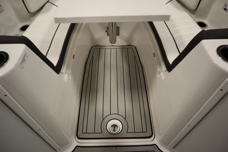 Slide: The Image of Interior of 2026 Yamaha Boats 222 FSH Sport E, featuring sleek seating and modern flooring. - 17