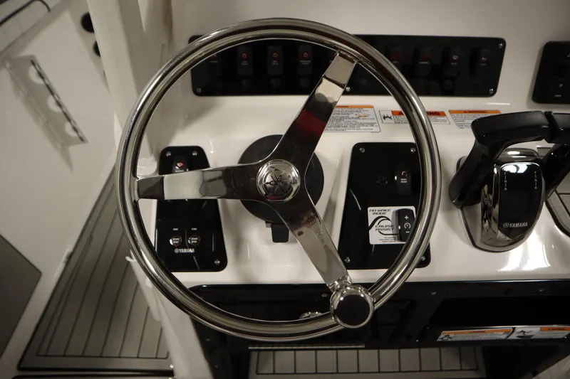 Slide: The Image of Steering wheel and controls of 2026 Yamaha Boats 222 FSH Sport E. - 30
