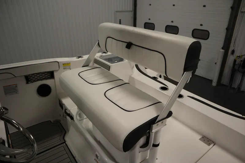 Slide: The Image of 2026 Yamaha Boats 222 FSH Sport E interior seating with sleek white upholstery. - 39