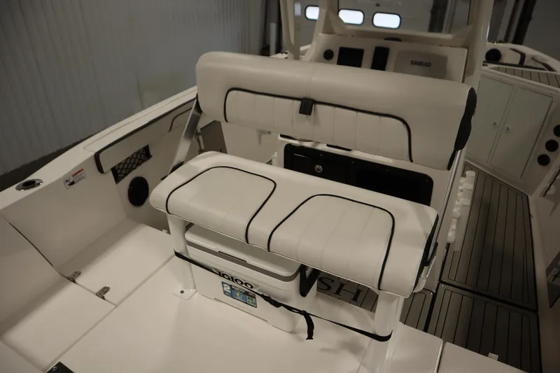 Slide: The Image of 2026 Yamaha Boats 222 FSH Sport E interior with white seating and modern design. - 40