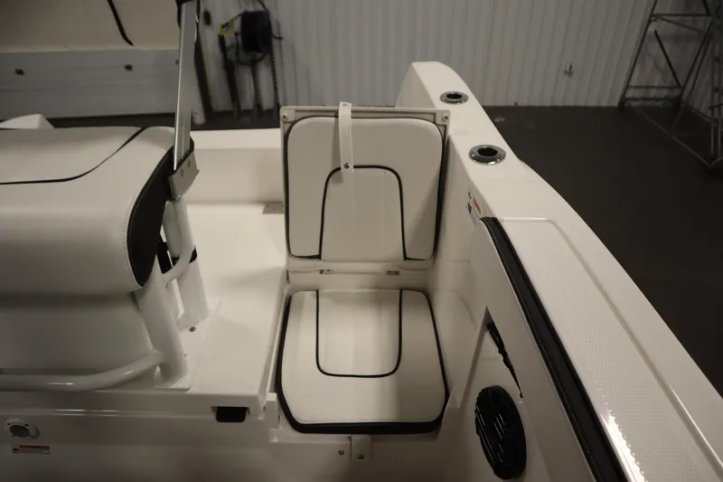 Slide: The Image of 2026 Yamaha Boats 222 FSH Sport E interior seating with white and black upholstery. - 42