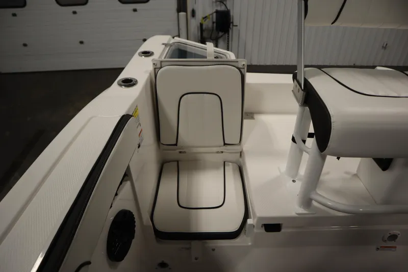 Slide: The Image of 2026 Yamaha Boats 222 FSH Sport E interior seating with white and black trim. - 44