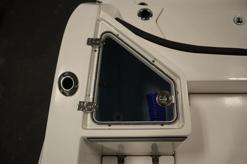 Slide: The Image of 2026 Yamaha Boats 222 FSH Sport E, featuring a sleek storage compartment. - 46