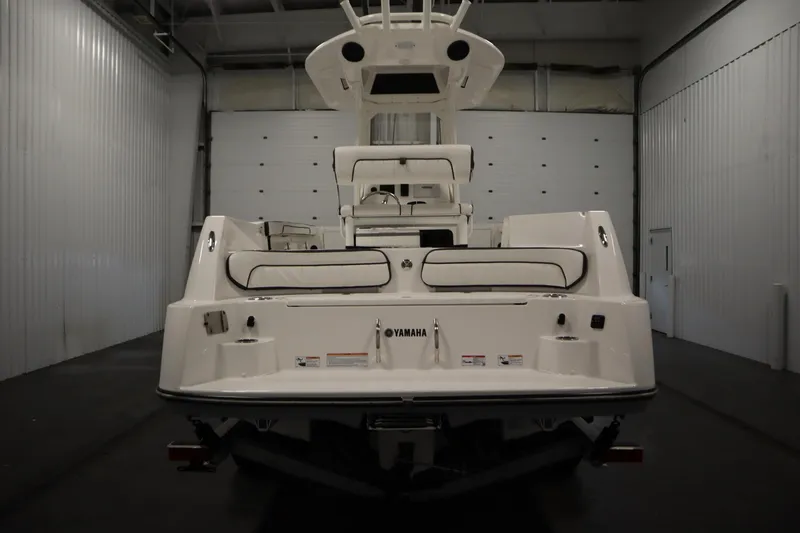 Slide: The Image of 2026 Yamaha Boats 222 FSH Sport E in a warehouse, rear view. - 5