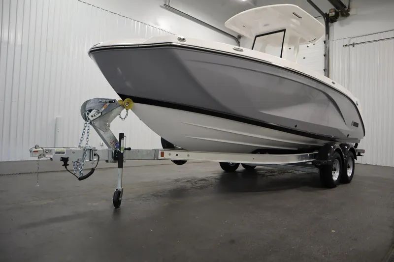 Slide: The Image of 2026 Yamaha Boats 222 FSH Sport E on trailer in indoor showroom. - 51