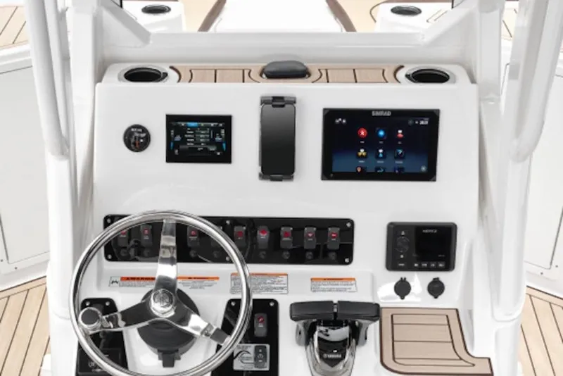 Slide: The Image of 2026 Yamaha Boats 222 FSH Sport E dashboard with steering wheel and digital displays. - 58