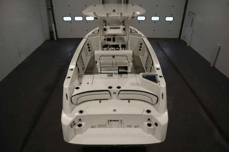 Slide: The Image of 2026 Yamaha Boats 222 FSH Sport E, interior view in a garage setting. - 9