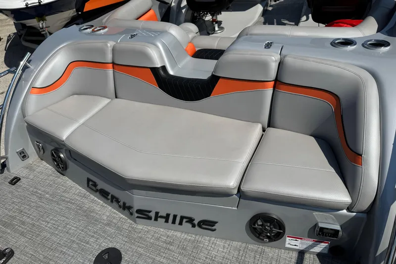 Slide: The Image of 2021 Berkshire 250 Super-Sport Premium boat seating with gray and orange accents. - 12