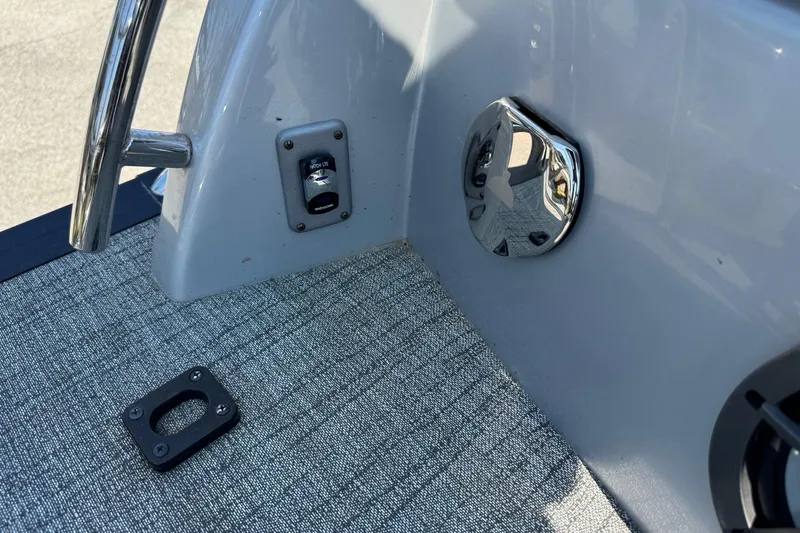 Slide: The Image of 2021 Berkshire 250 Super-Sport Premium boat interior detail with chrome and fabric elements. - 14