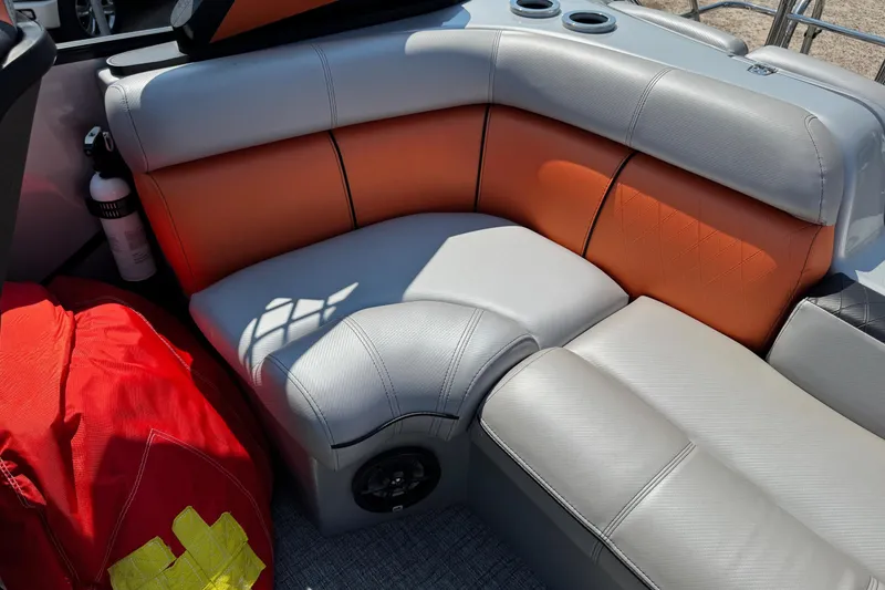 Slide: The Image of 2021 Berkshire 250 Super-Sport Premium boat interior with orange and gray seating. - 15