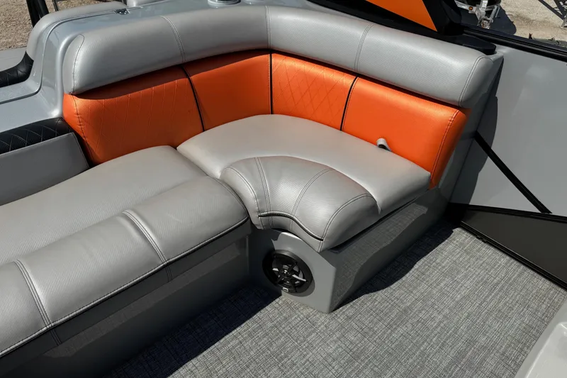 Slide: The Image of 2021 Berkshire 250 Super-Sport Premium boat interior with orange and gray seating. - 16