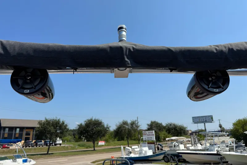 Slide: The Image of 2021 Berkshire 250 Super-Sport Premium boat speakers under canopy, clear sky background. - 18