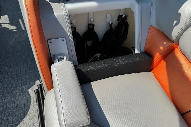 Slide: The Image of 2021 Berkshire 250 Super-Sport Premium boat seat with storage compartment, featuring orange and gray upholstery. - 32