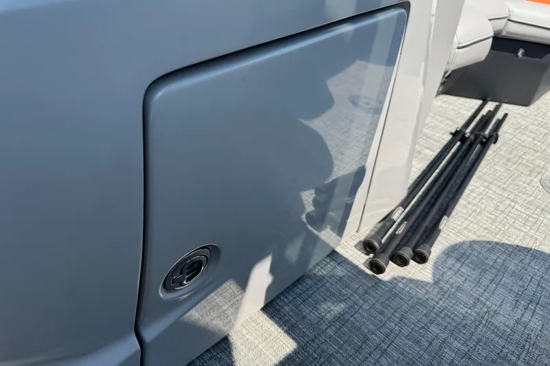 Slide: The Image of 2021 Berkshire 250 Super-Sport Premium boat interior with storage compartment and accessories. - 39