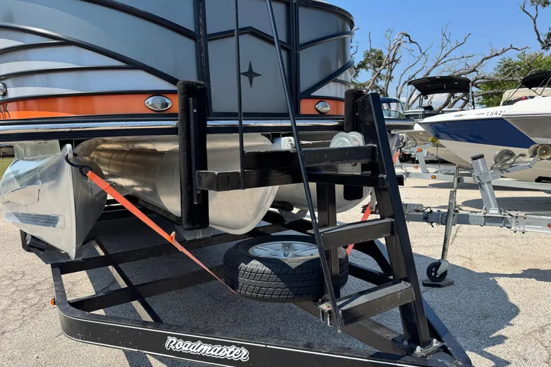 Slide: The Image of 2021 Berkshire 250 Super-Sport Premium pontoon boat on a Roadmaster trailer. - 4