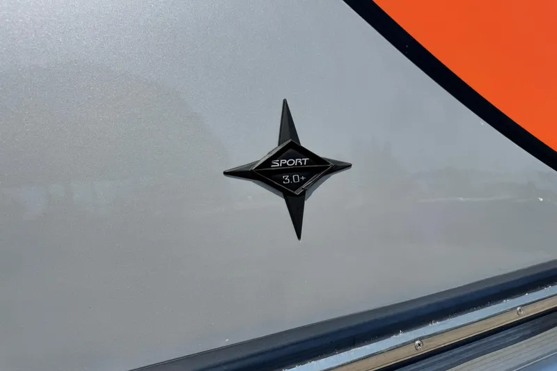 Slide: The Image of 2021 Berkshire 250 Super-Sport Premium emblem on sleek gray and orange surface. - 5