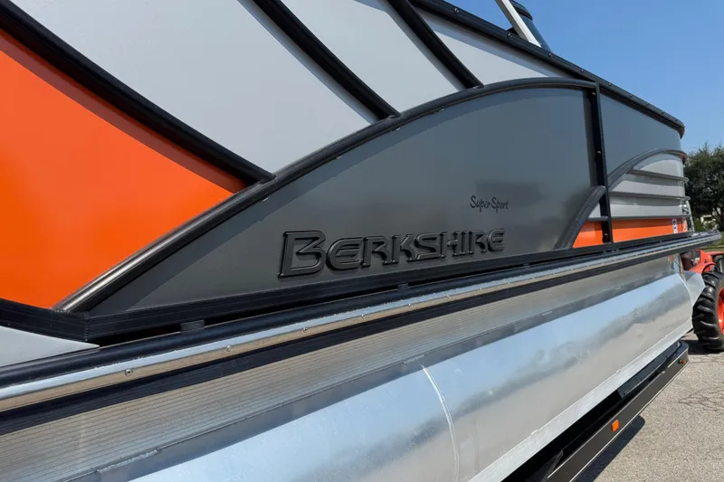 Slide: The Image of 2021 Berkshire 250 Super-Sport Premium boat with sleek design and vibrant orange accents. - 6