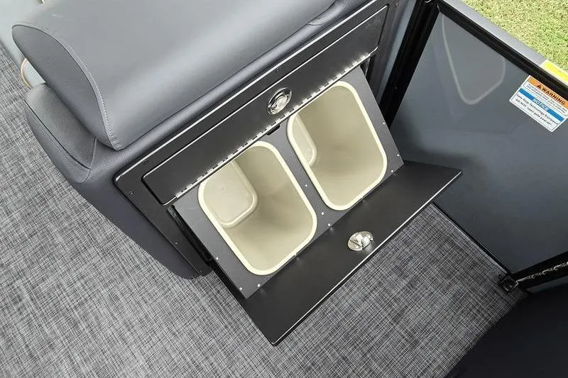 Slide: The Image of 2026 Godfrey SWEETWATER 2286 SB interior with dual trash bins and sleek design. - 16