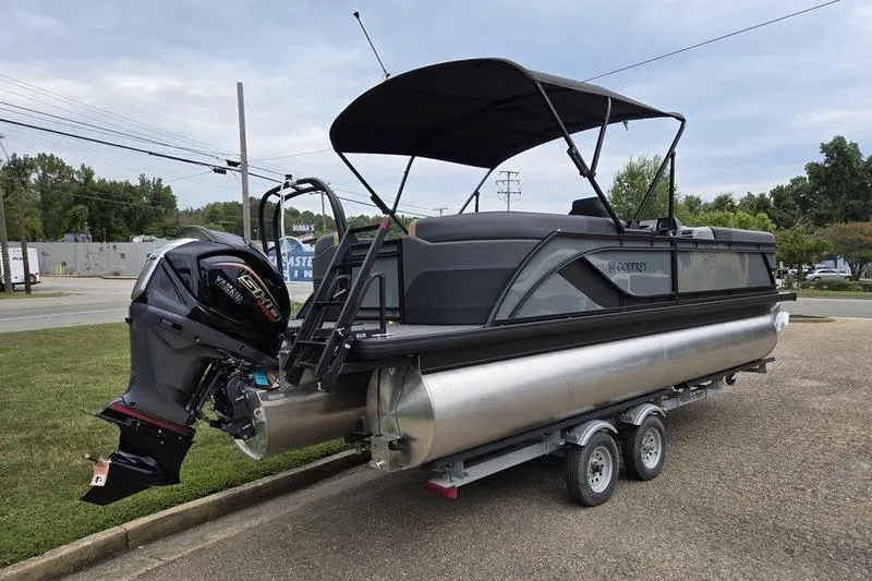 Slide: The Image of 2026 Godfrey SWEETWATER 2286 SB pontoon boat on trailer, featuring a powerful outboard motor. - 5