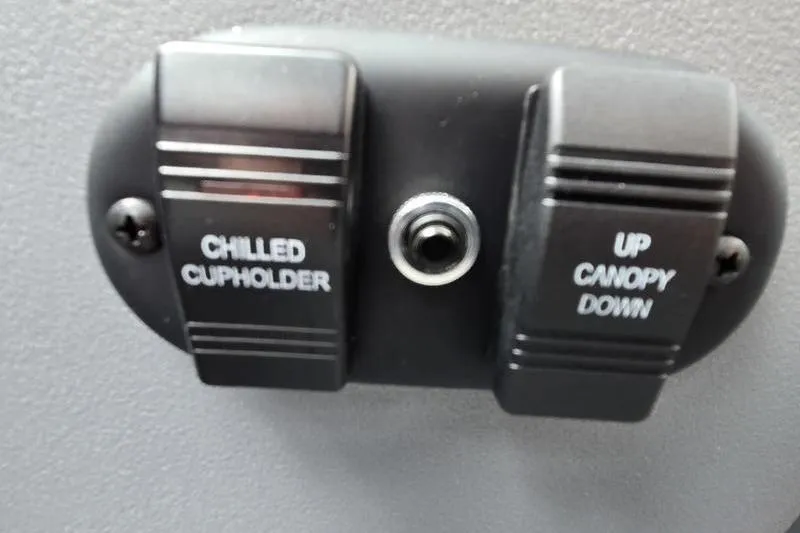 Slide: The Image of Control panel with chilled cupholder and canopy switches on 2026 Godfrey SWEETWATER 2286 SB. - 9