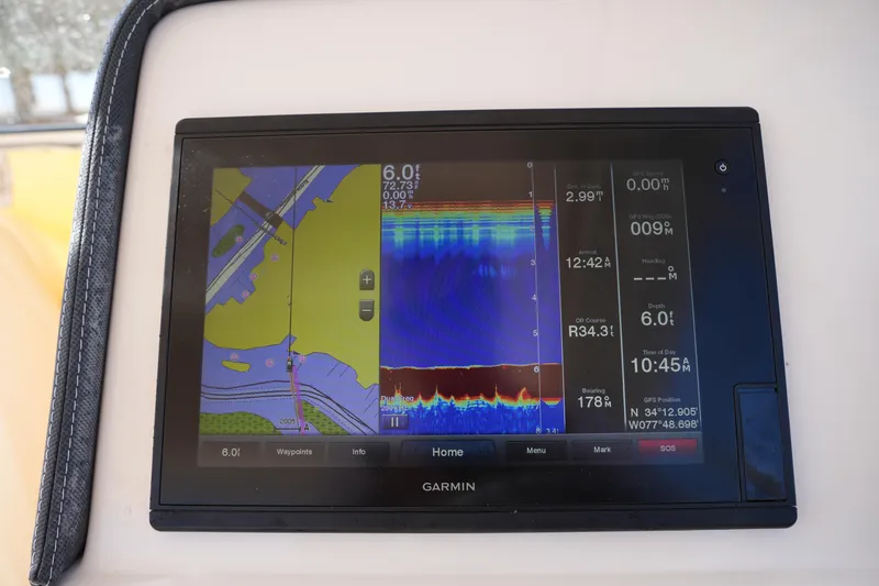 Slide: The Image of Garmin marine GPS display on 2019 Grady-White Freedom 235 boat dashboard. - 23