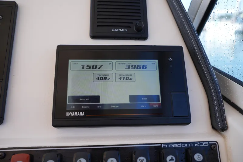 Slide: The Image of Yamaha display on 2019 Grady-White Freedom 235 boat, showing trip data and engine hours. - 24