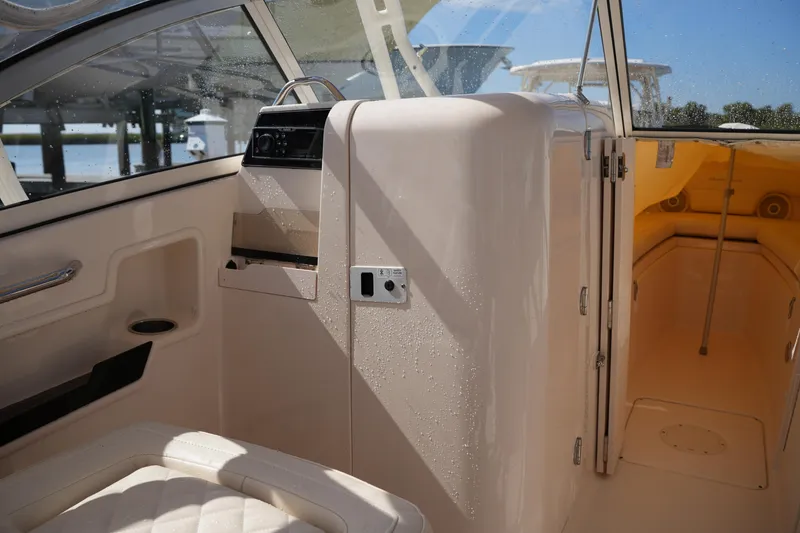Slide: The Image of Interior view of 2019 Grady-White Freedom 235 boat, featuring cabin and seating area. - 27