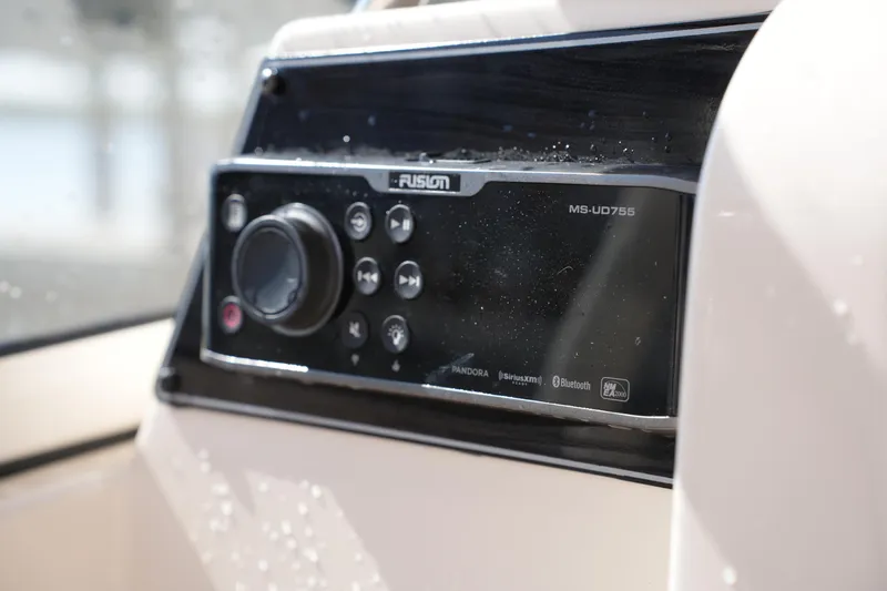 Slide: The Image of Fusion MS-UD755 audio system on 2019 Grady-White Freedom 235 boat dashboard. - 28