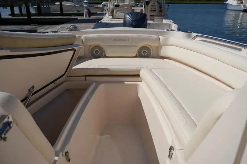 Slide: The Image of 2019 Grady-White Freedom 235 boat interior with spacious seating and storage. - 31