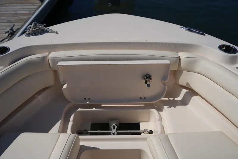 Slide: The Image of 2019 Grady-White Freedom 235 boat interior with seating and storage compartment. - 33