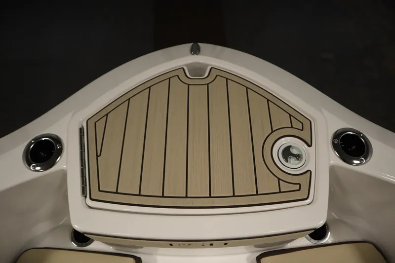 Slide: The Image of 2026 Yamaha Boats 252 FSH Sport deck with sleek wood finish and cup holders. - 11