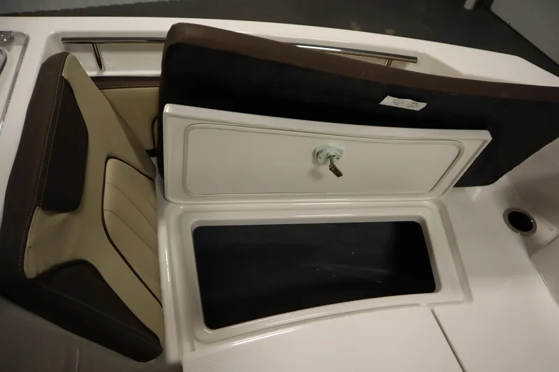 Slide: The Image of 2026 Yamaha Boats 252 FSH Sport storage compartment with cushioned seating. - 13