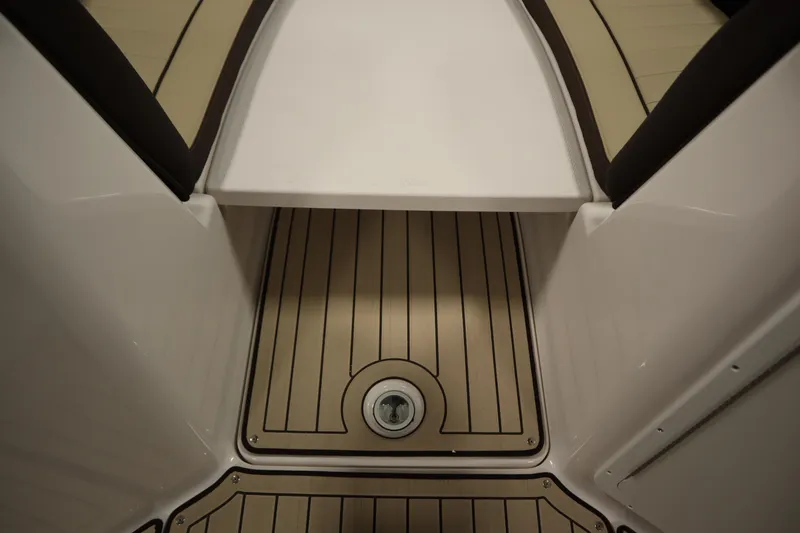 Slide: The Image of 2026 Yamaha Boats 252 FSH Sport interior with sleek, modern flooring design. - 14
