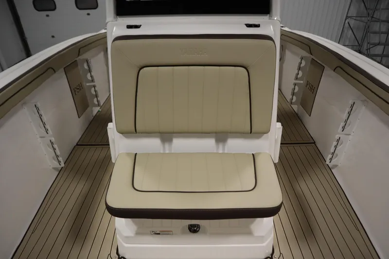 Slide: The Image of 2026 Yamaha Boats 252 FSH Sport interior with beige seating and sleek design. - 18