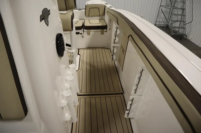 Slide: The Image of 2026 Yamaha Boats 252 FSH Sport interior with sleek seating and rod holders. - 20