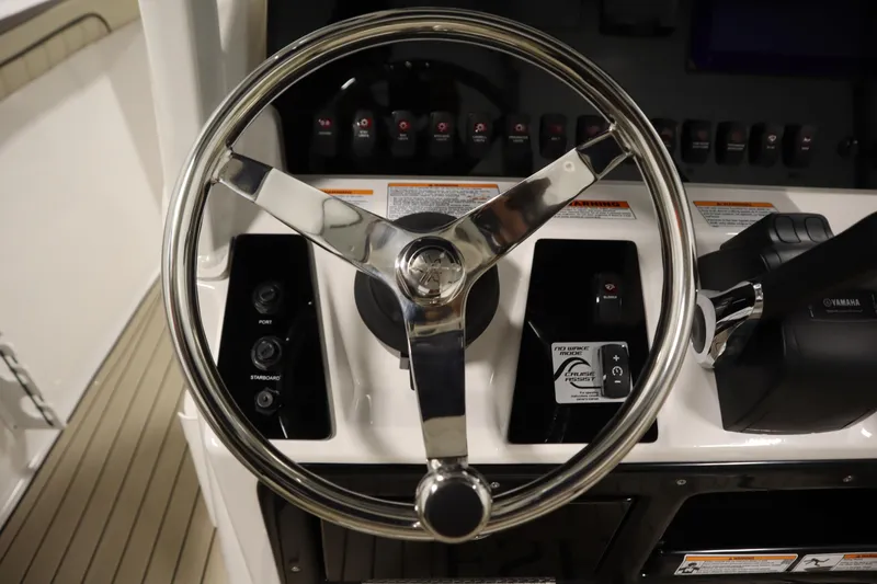 Slide: The Image of Steering wheel and controls of 2026 Yamaha Boats 252 FSH Sport. - 23