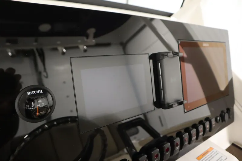 Slide: The Image of Yamaha Boats 2026 252 FSH Sport dashboard with compass and digital displays. - 24